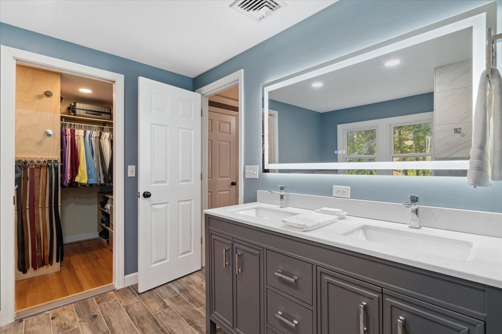 10 Fieldstone Way Boxford, MA 01921 - Photo 25 of 42 a bathroom with a double vanity sink and a mirror