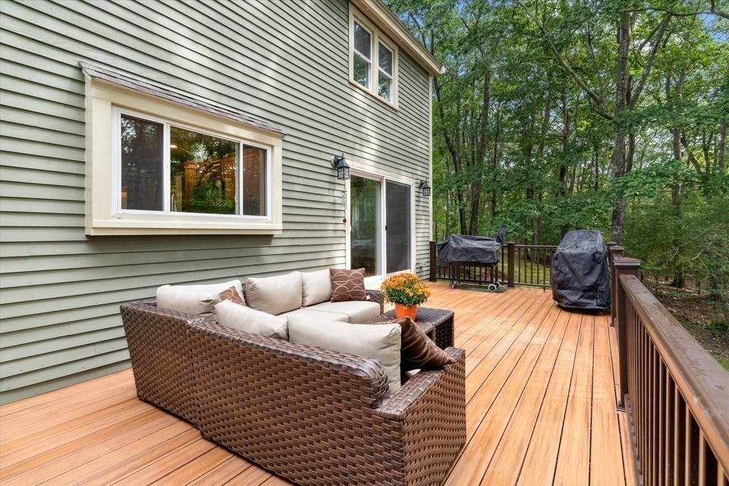 10 Fieldstone Way Boxford, MA 01921 - Photo 34 of 42 a view of a patio with couches chairs and wooden floor