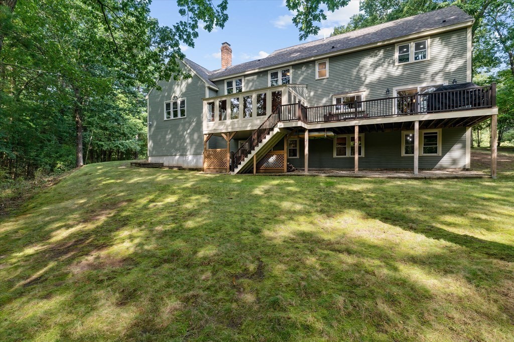 10 Fieldstone Way Boxford, MA 01921 - Photo 36 of 42 a view of a house with a yard and sitting area