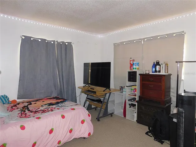 a room with a closet and wooden floor