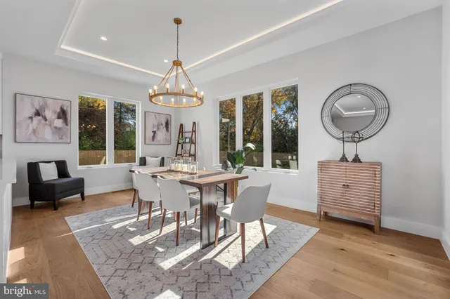 a living room with fireplace furniture and a wooden floor