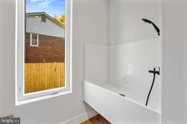 a living room with furniture rug and window