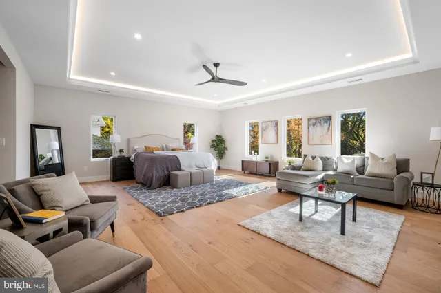 a spacious bathroom with a glass shower door and a bathtub