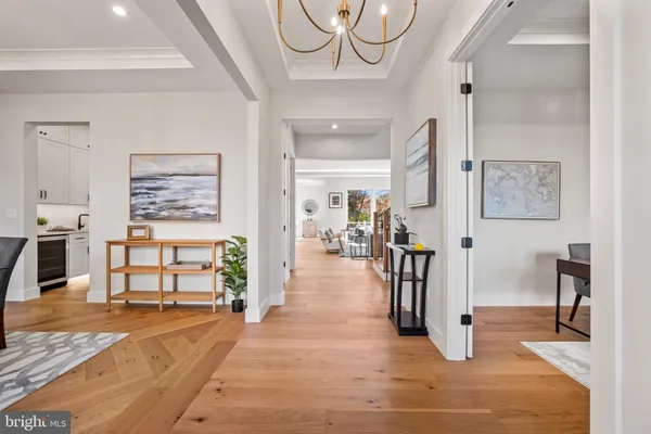 a large kitchen with stainless steel appliances lots of counter space and a sink