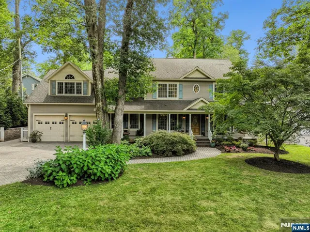 a aerial view of a house with a yard
