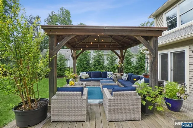 a view of a patio with couches chairs and potted plants