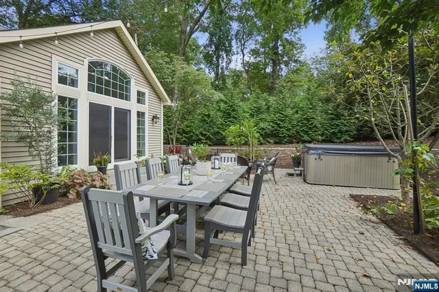 a view of a patio with a table and chairs