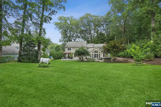 a view of a chair and table in the garden
