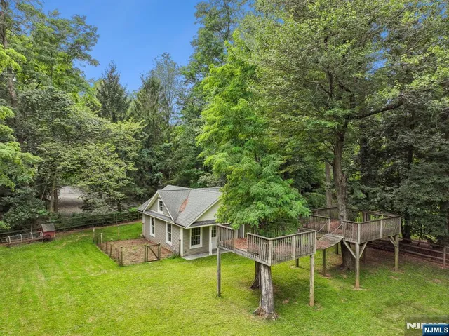 a view of a chairs and table in the garden
