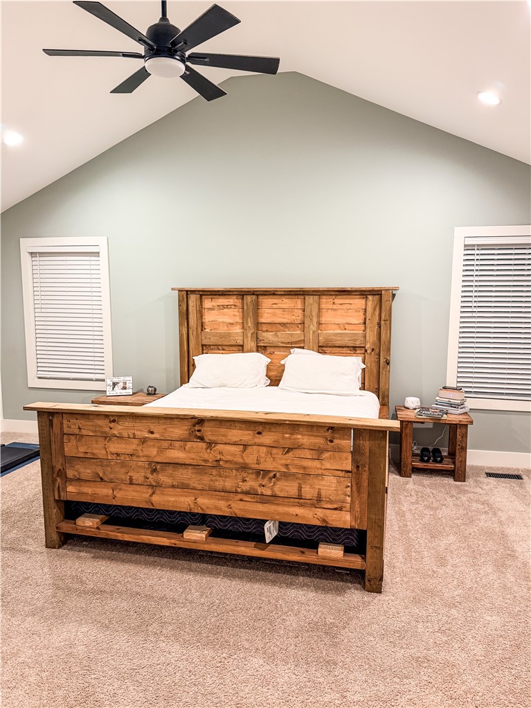 757 Belle Shoals Road Pickens, SC 29671 - Photo 25 of 31 Natural light illuminates this bedroom, offering a comforting retreat with its unique wooden bed frame.