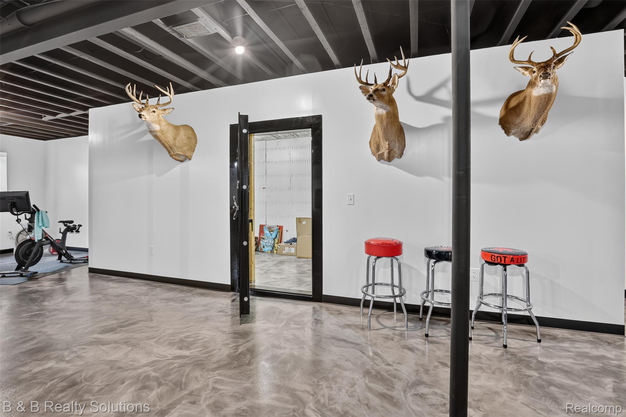 6204 Fish Lake Road North Branch, MI 48461 - Photo 52 of 79 Expansive recreation space featuring metallic epoxy flooring and an exposed beam ceiling