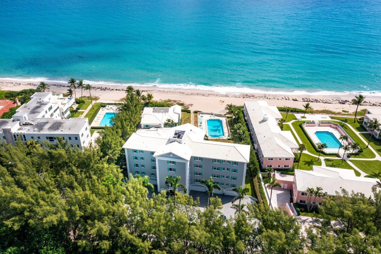 2665 North Ocean Boulevard, Unit 3 Gulf Stream, FL 33483 - Photo 18 of 50 a view of a chairs and table in patio