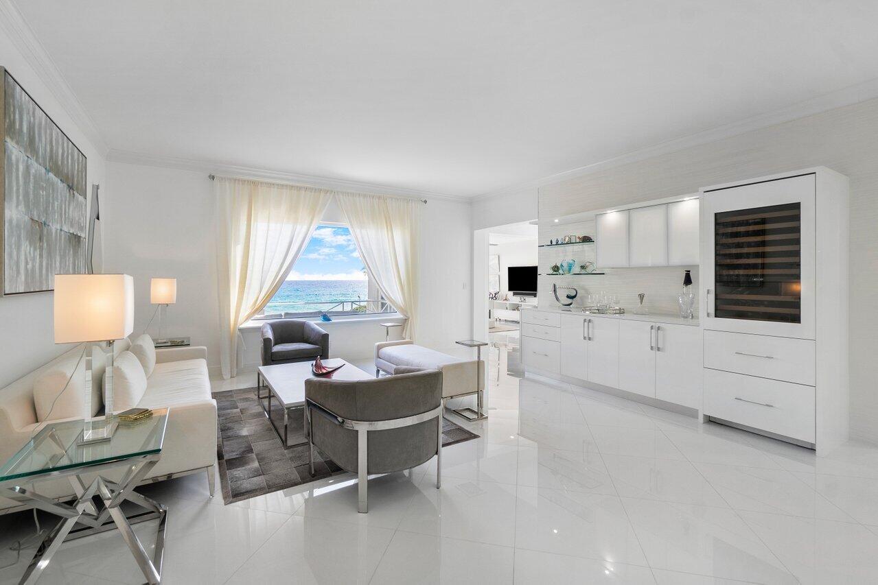 2665 North Ocean Boulevard, Unit 3 Gulf Stream, FL 33483 - Photo 21 of 50 a living room with furniture and a large window