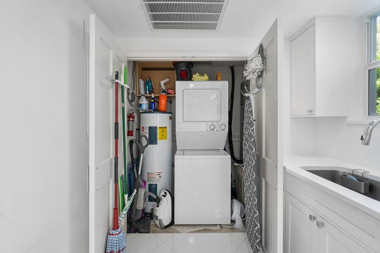 2665 North Ocean Boulevard, Unit 3 Gulf Stream, FL 33483 - Photo 28 of 50 a utility room with dryer and washer