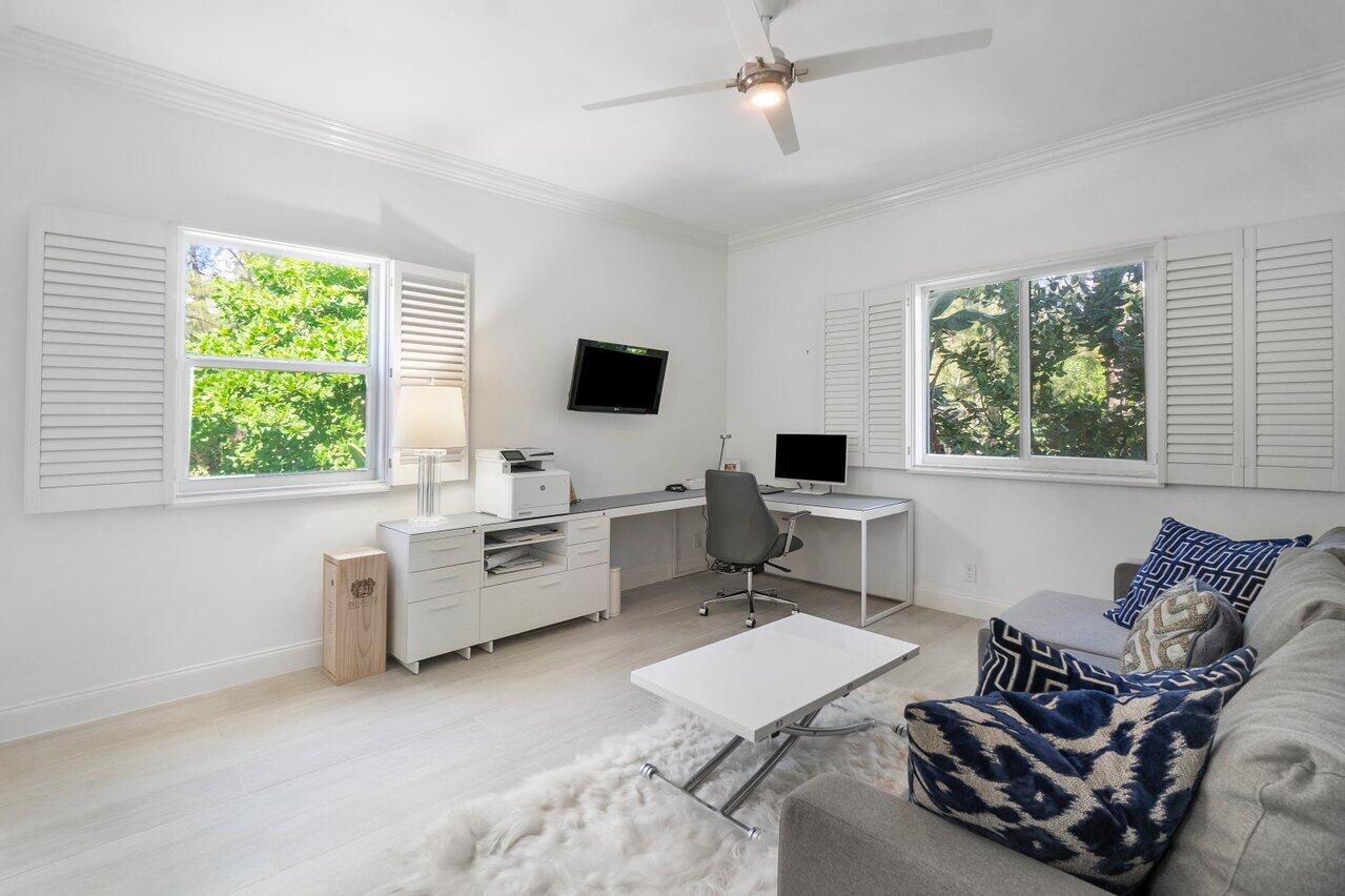 2665 North Ocean Boulevard, Unit 3 Gulf Stream, FL 33483 - Photo 29 of 50 a living room with furniture a window and a flat screen tv