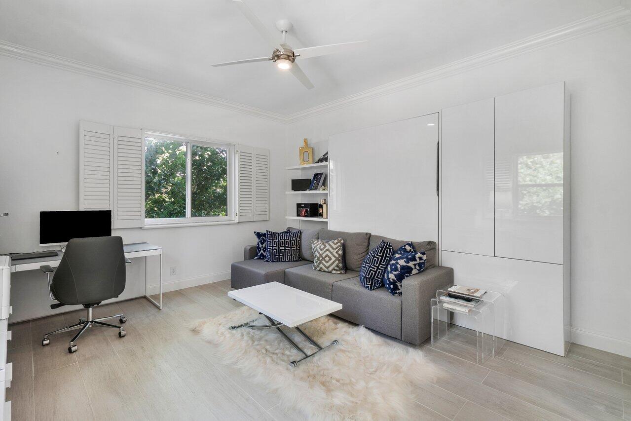 2665 North Ocean Boulevard, Unit 3 Gulf Stream, FL 33483 - Photo 30 of 50 a living room with furniture and a window
