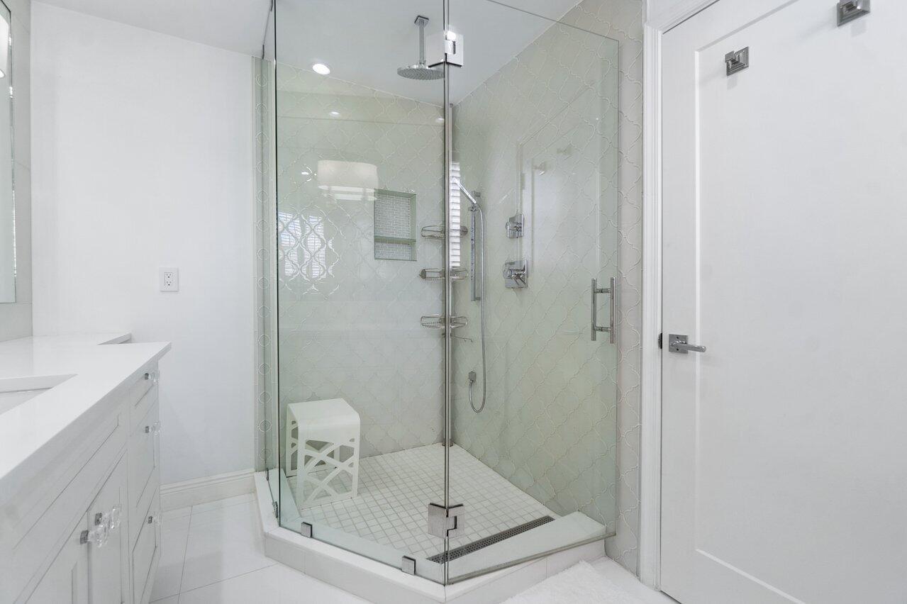 2665 North Ocean Boulevard, Unit 3 Gulf Stream, FL 33483 - Photo 31 of 50 a bathroom with a shower