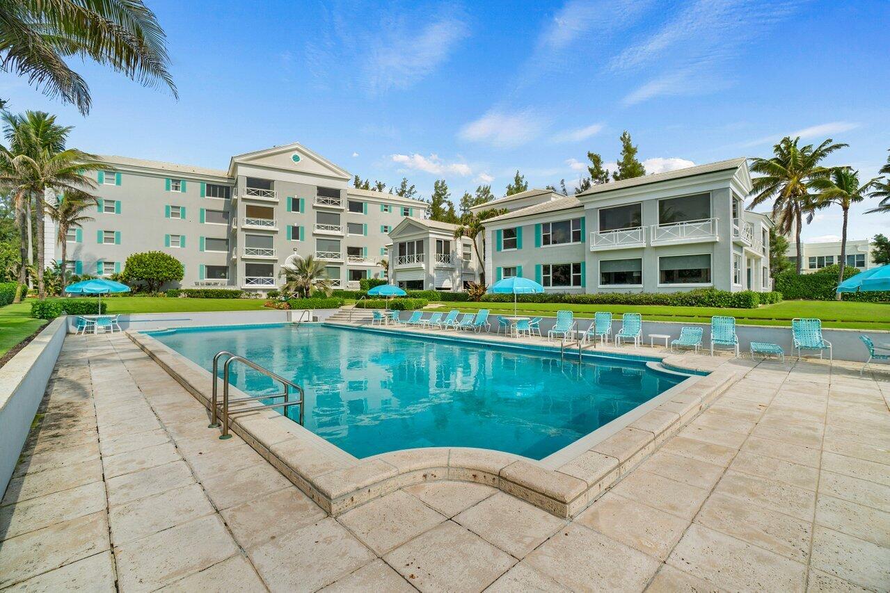 2665 North Ocean Boulevard, Unit 3 Gulf Stream, FL 33483 - Photo 38 of 50 a view of a swimming pool and a yard