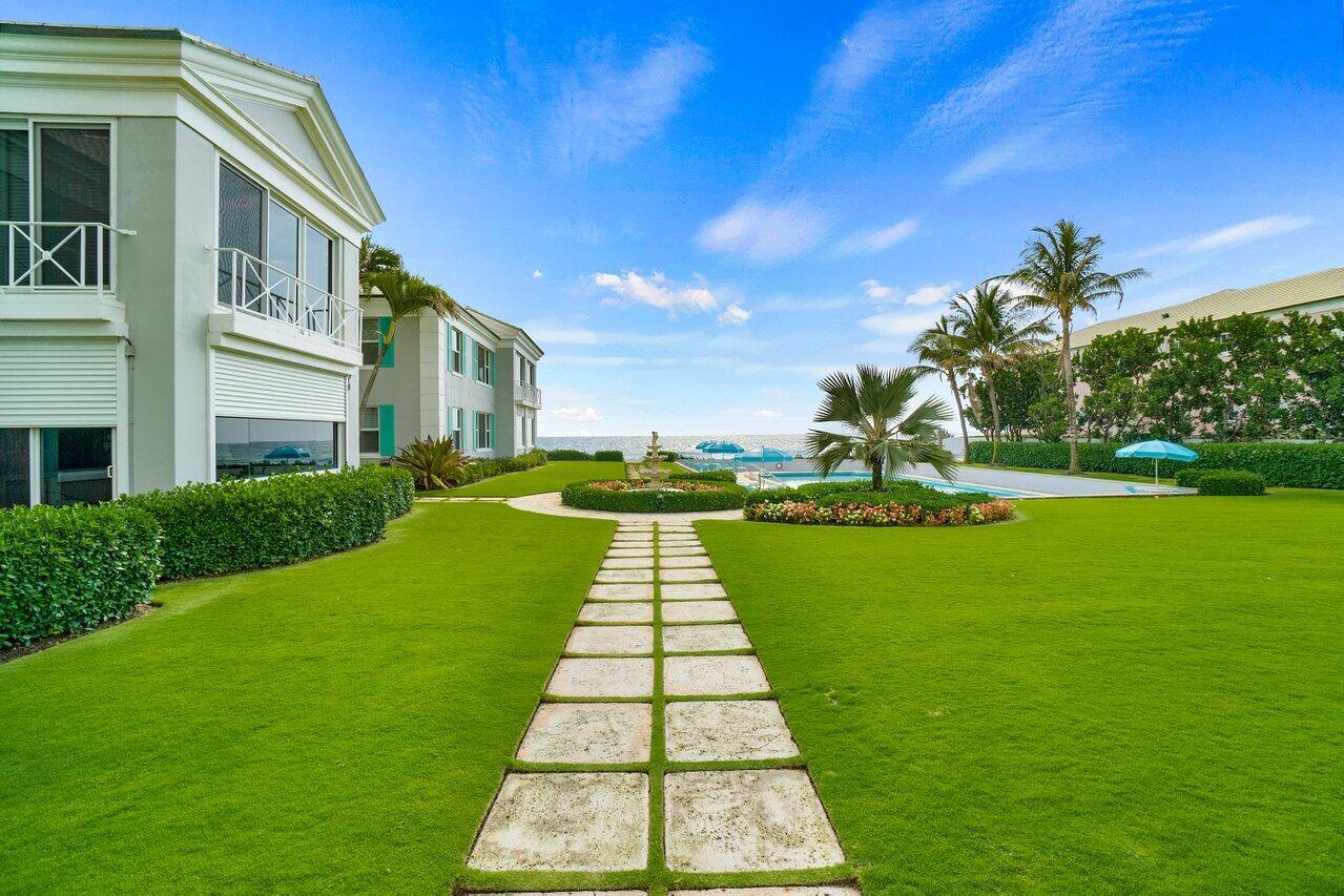 2665 North Ocean Boulevard, Unit 3 Gulf Stream, FL 33483 - Photo 39 of 50 a view of swimming pool with a garden