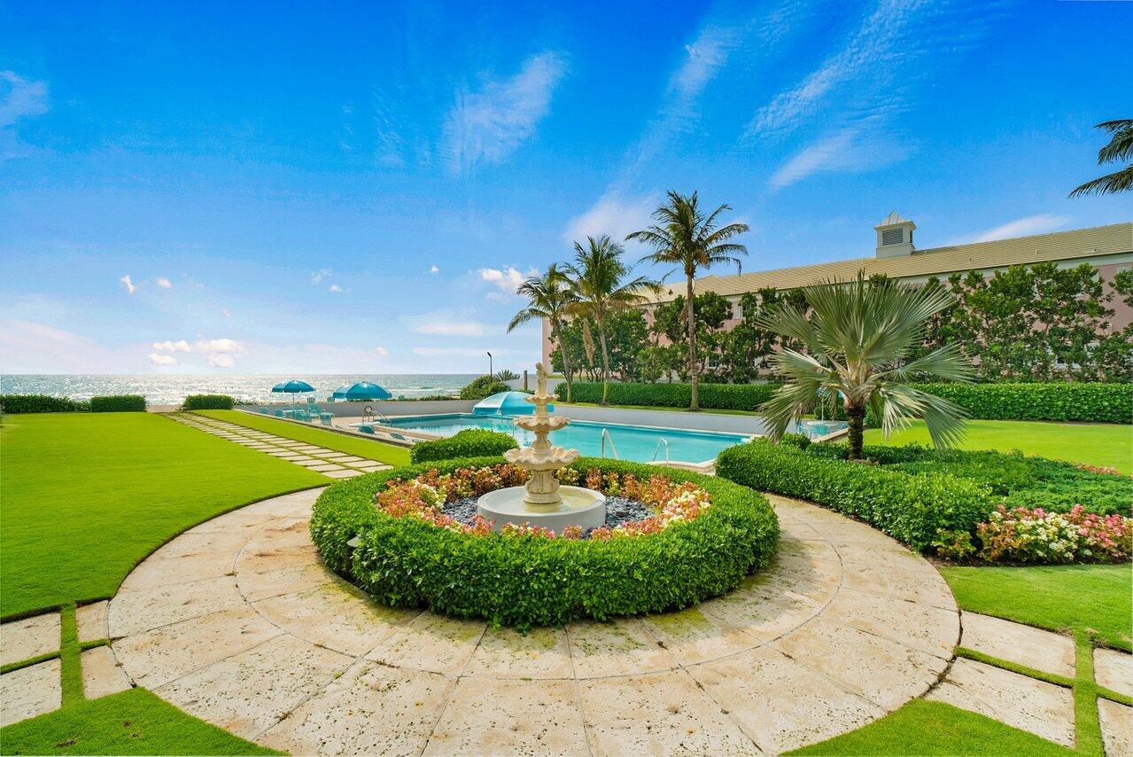 2665 North Ocean Boulevard, Unit 3 Gulf Stream, FL 33483 - Photo 40 of 50 a view of a swimming pool with a yard