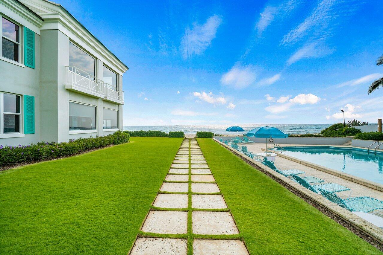 2665 North Ocean Boulevard, Unit 3 Gulf Stream, FL 33483 - Photo 41 of 50 a view of swimming pool with a yard