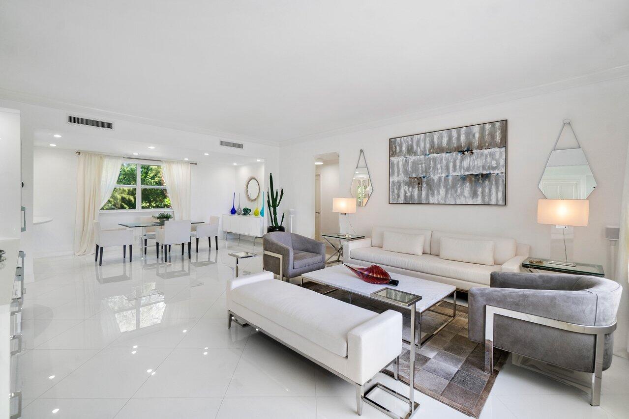 2665 North Ocean Boulevard, Unit 3 Gulf Stream, FL 33483 - Photo 7 of 50 a living room with furniture and a night stand