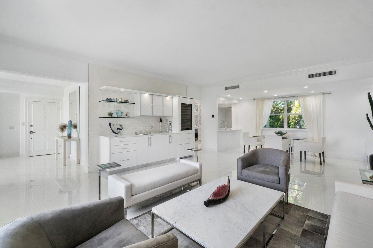 2665 North Ocean Boulevard, Unit 3 Gulf Stream, FL 33483 - Photo 8 of 50 a living room with furniture and a table