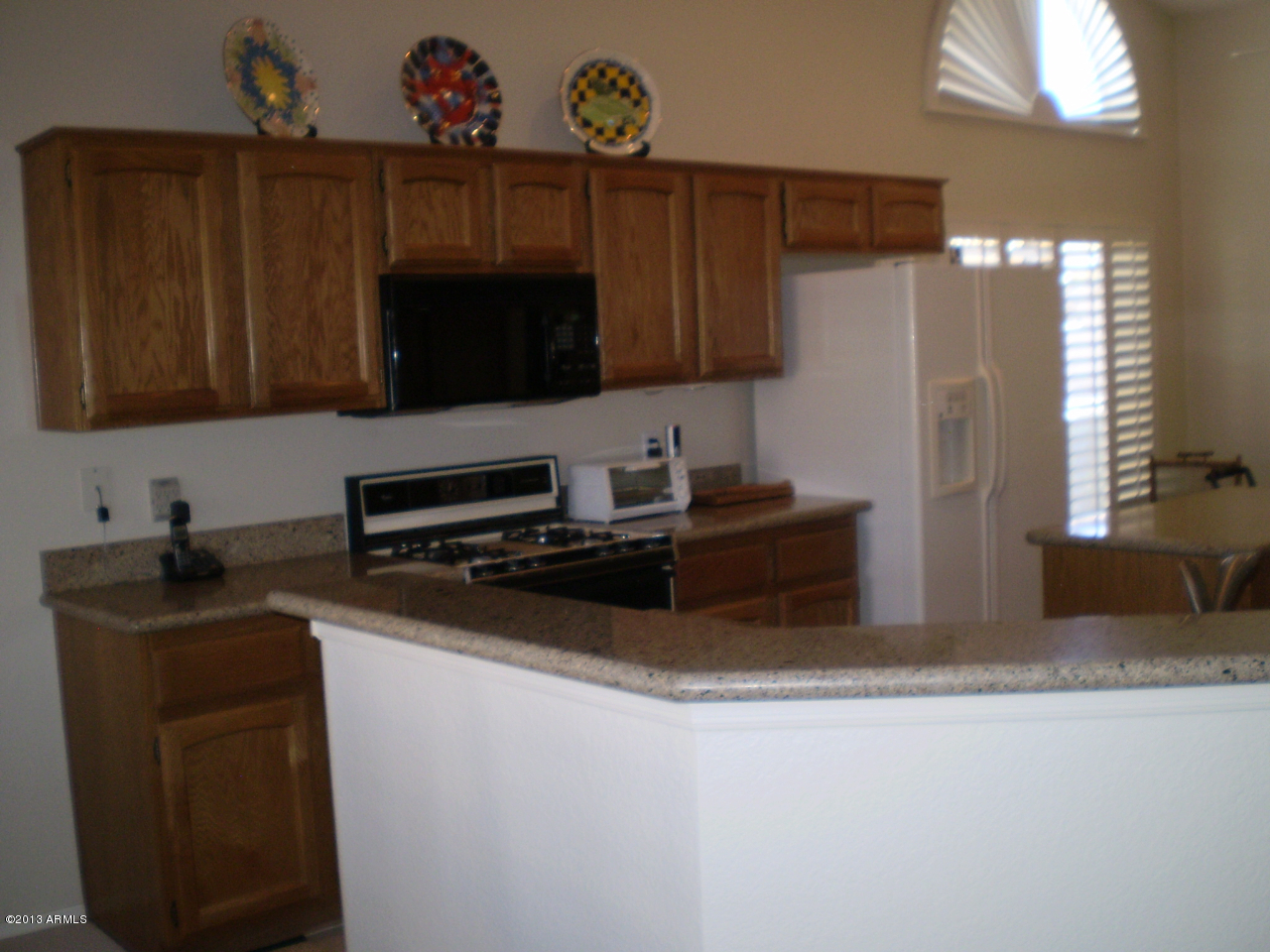 15814 Piccadilly Road Goodyear, AZ 85395 - Photo 12 of 24 Kitchen Peninsula Bar