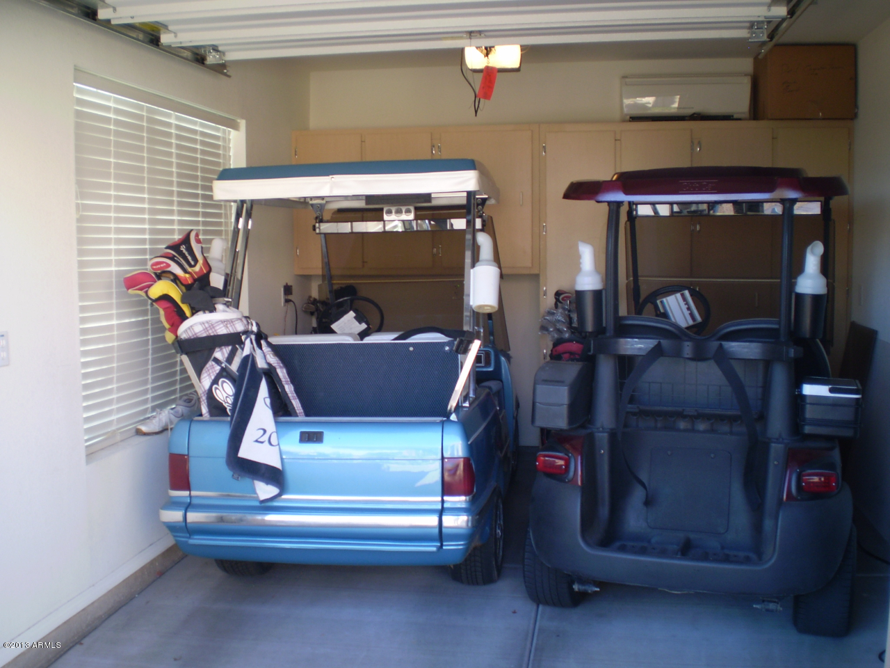 15814 Piccadilly Road Goodyear, AZ 85395 - Photo 4 of 24 Golf Cart Garage w/storage Cabinets