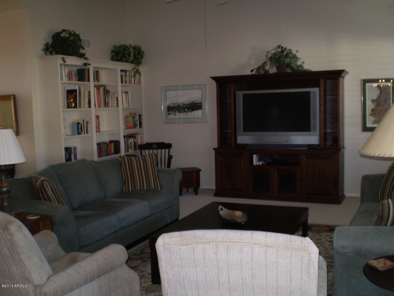 15814 Piccadilly Road Goodyear, AZ 85395 - Photo 8 of 24 Great Room w/Built-in Bookcase