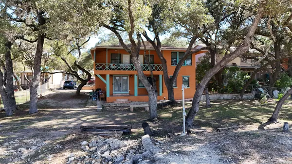 a view of a park with large trees