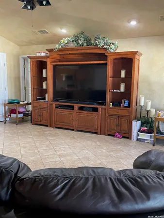 a kitchen with granite countertop a sink and a stove
