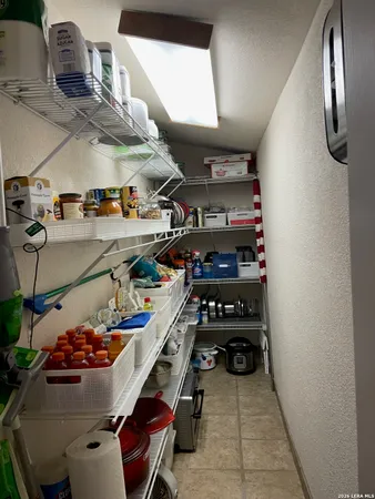 a view of a lake with a big yard and large trees