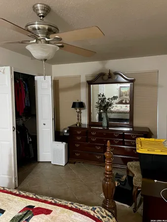 a bed sitting in a bedroom and table