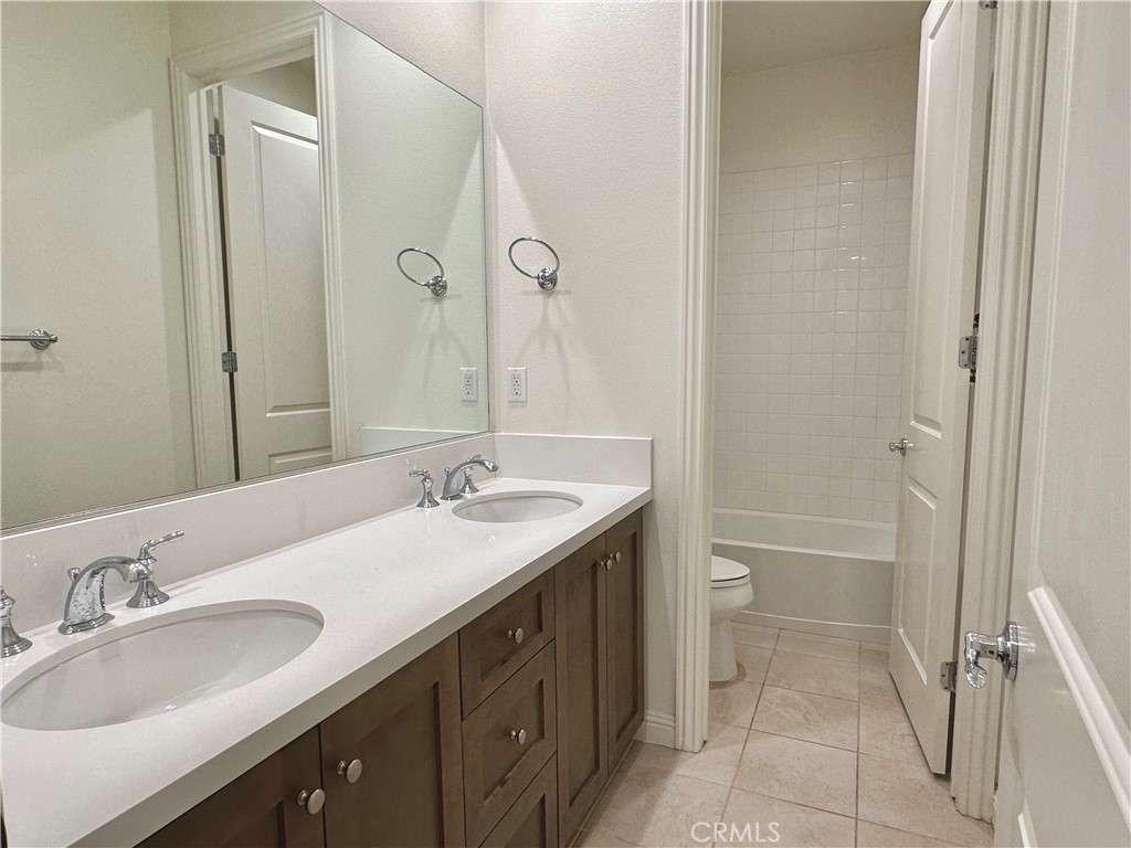 158 Bryce Run Lake Forest, CA 92630 - Photo 17 of 27 a bathroom with a granite countertop sink toilet and shower