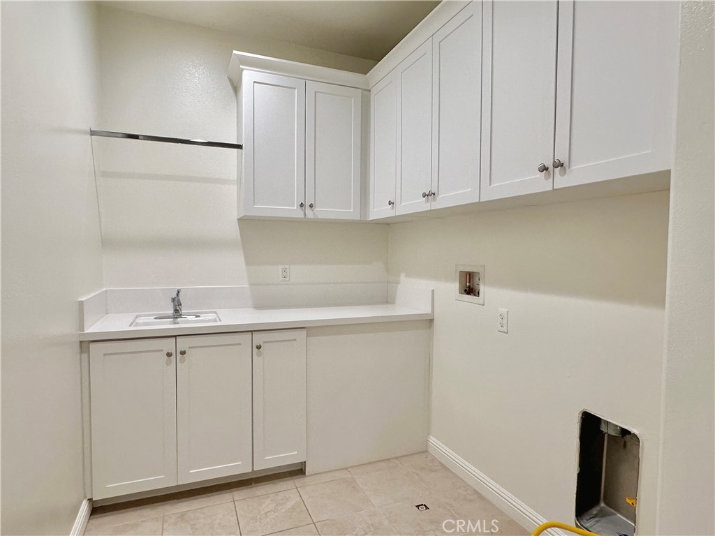 158 Bryce Run Lake Forest, CA 92630 - Photo 20 of 27 a kitchen with white cabinets