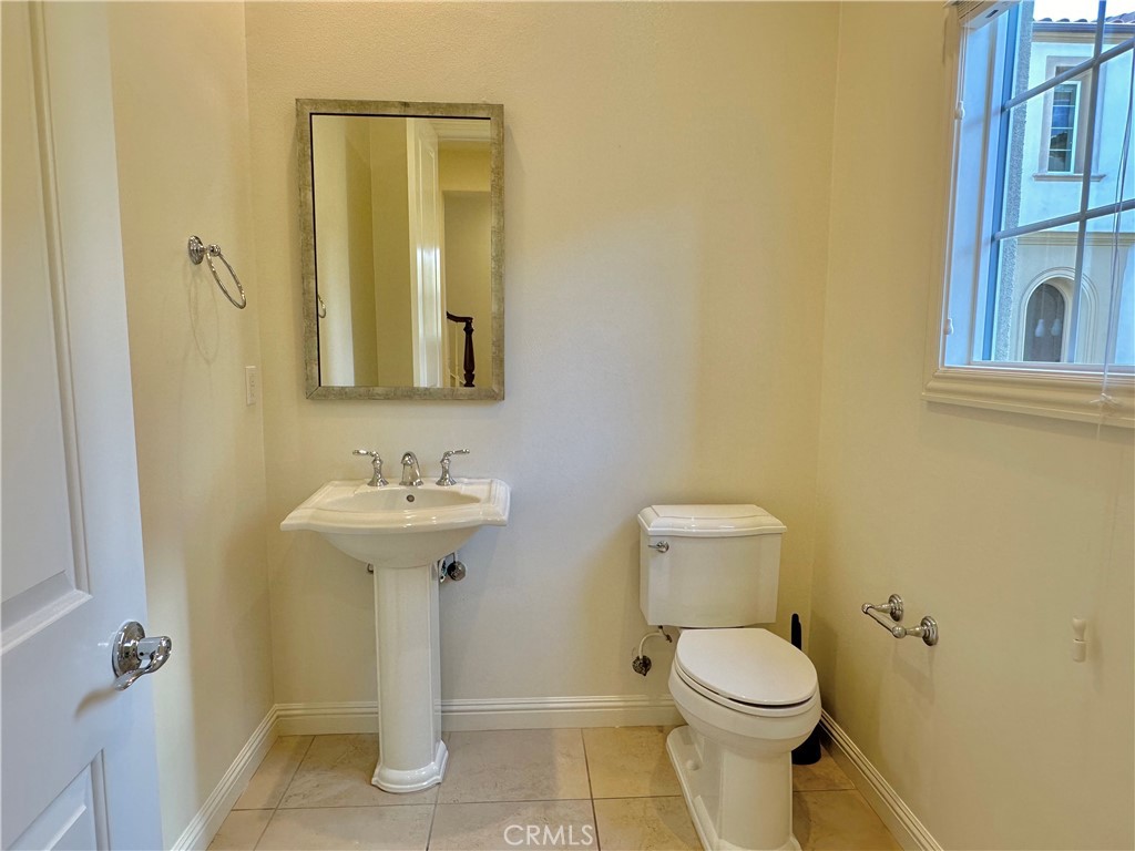 158 Bryce Run Lake Forest, CA 92630 - Photo 7 of 27 a bathroom with a toilet sink and mirror
