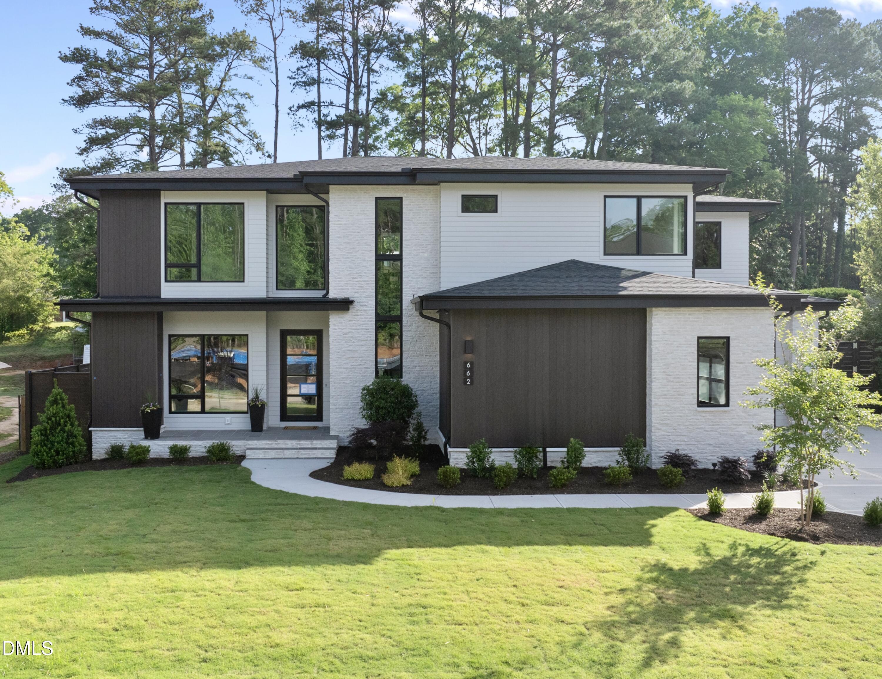 662 Manchester Drive Raleigh, NC 27609 - Photo 1 of 46 a front view of house with yard and outdoor seating