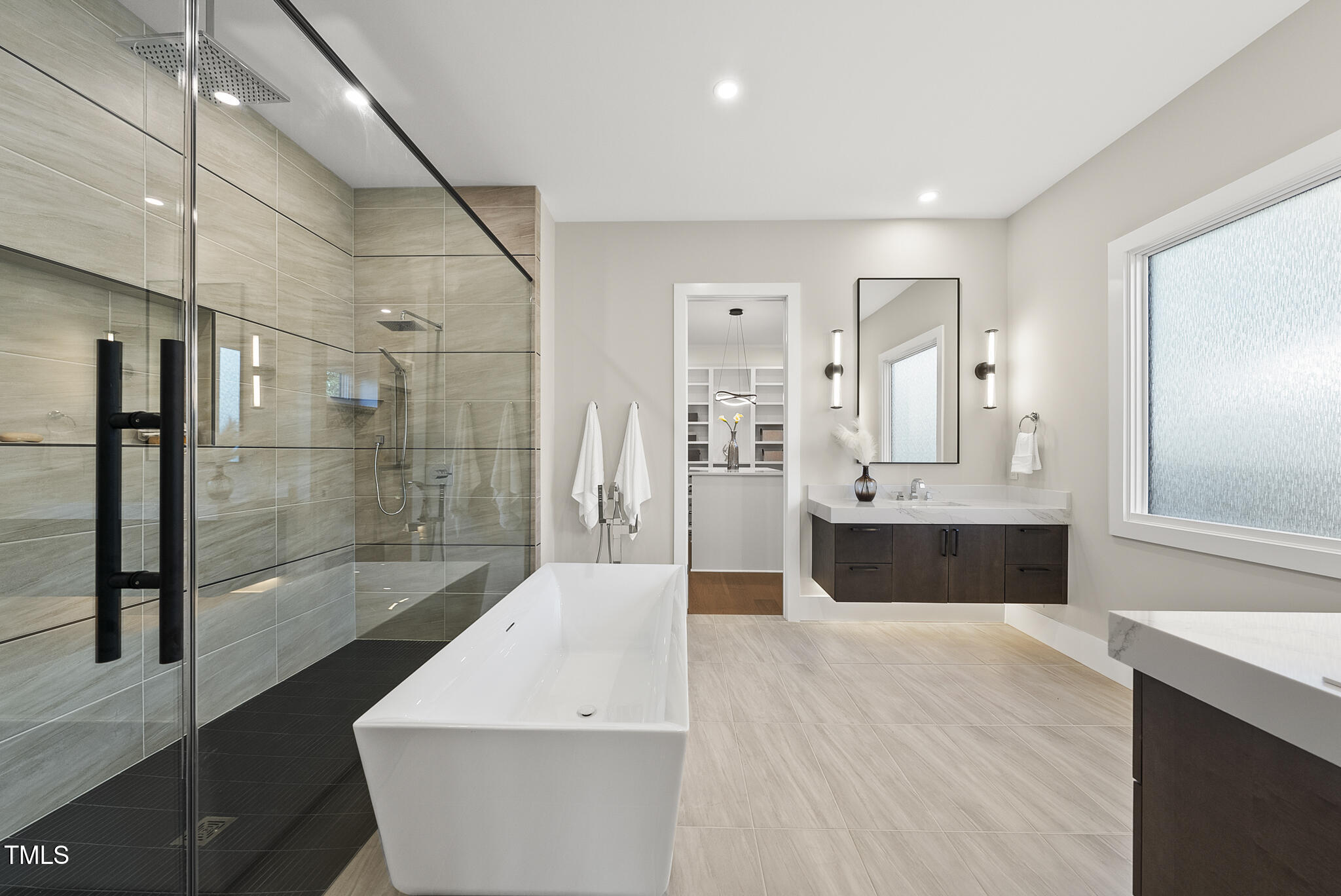 662 Manchester Drive Raleigh, NC 27609 - Photo 15 of 46 a spacious bathroom with a bathtub and shower