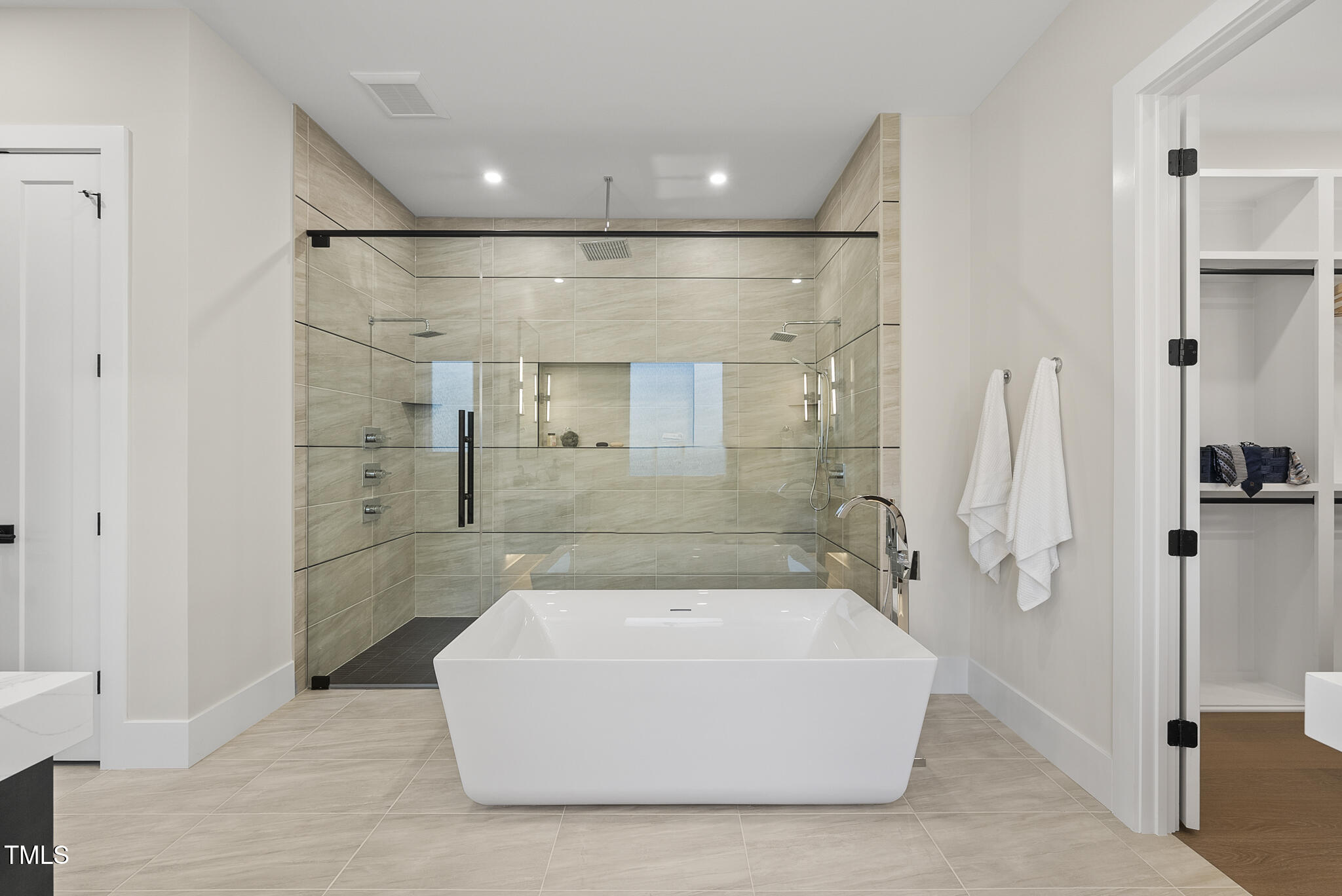 662 Manchester Drive Raleigh, NC 27609 - Photo 18 of 46 a bathroom with a bathtub and shower