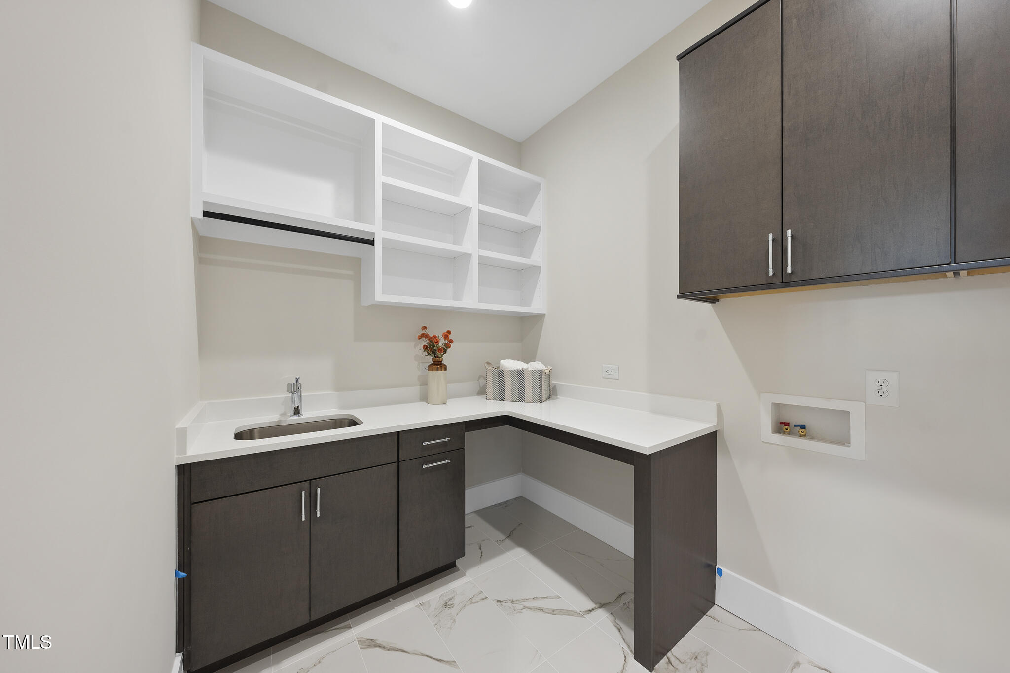 662 Manchester Drive Raleigh, NC 27609 - Photo 22 of 46 a kitchen with a sink and cabinets