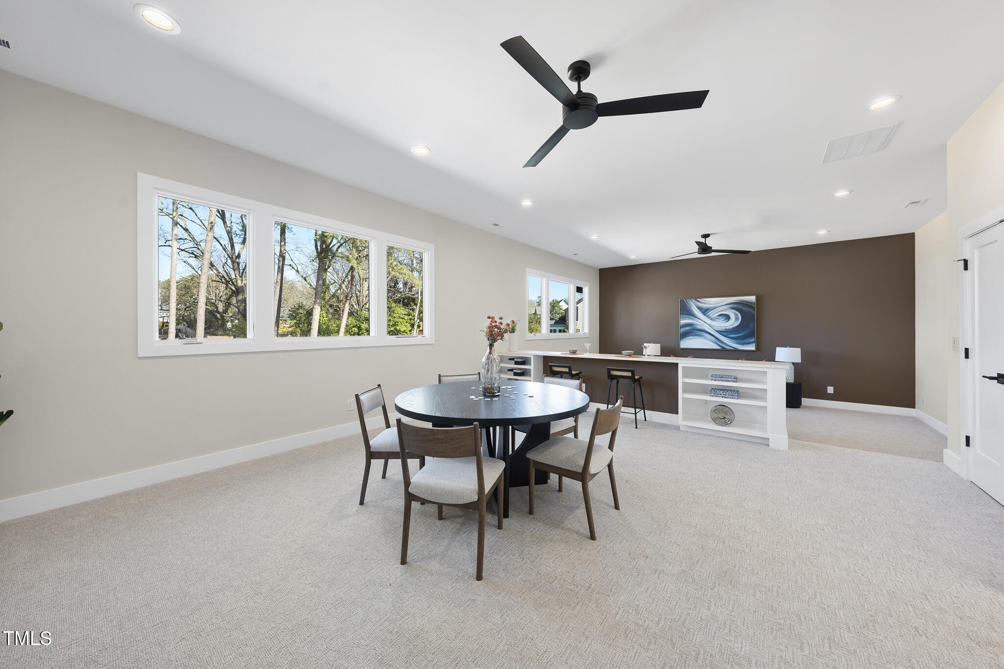 662 Manchester Drive Raleigh, NC 27609 - Photo 25 of 46 a view of a dining room with furniture window and wooden floor