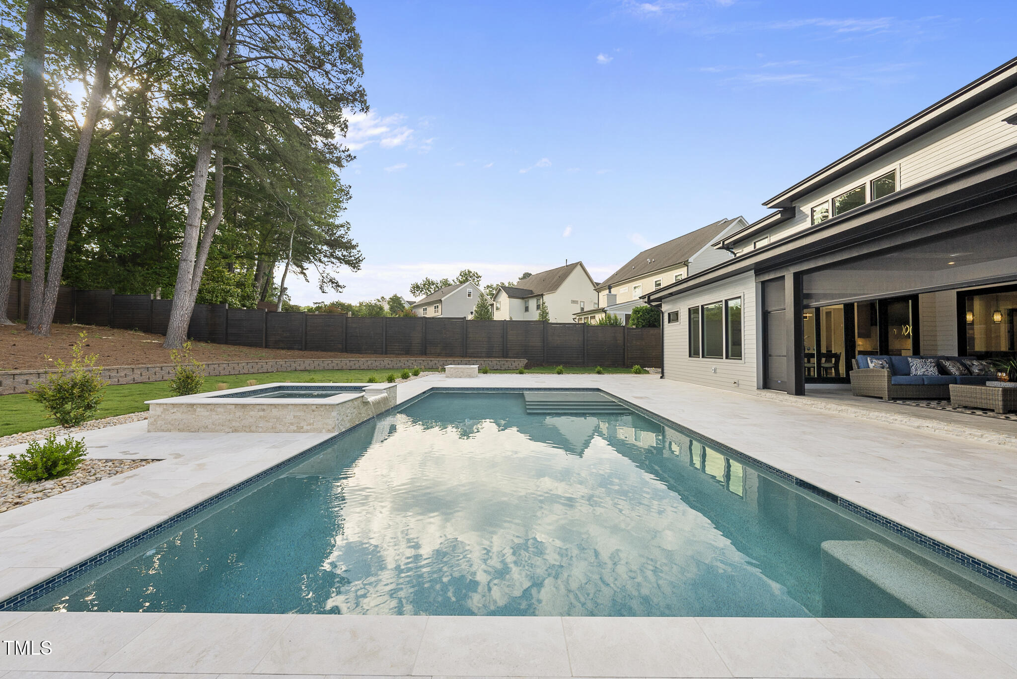 662 Manchester Drive Raleigh, NC 27609 - Photo 41 of 46 a view of a swimming pool with a patio