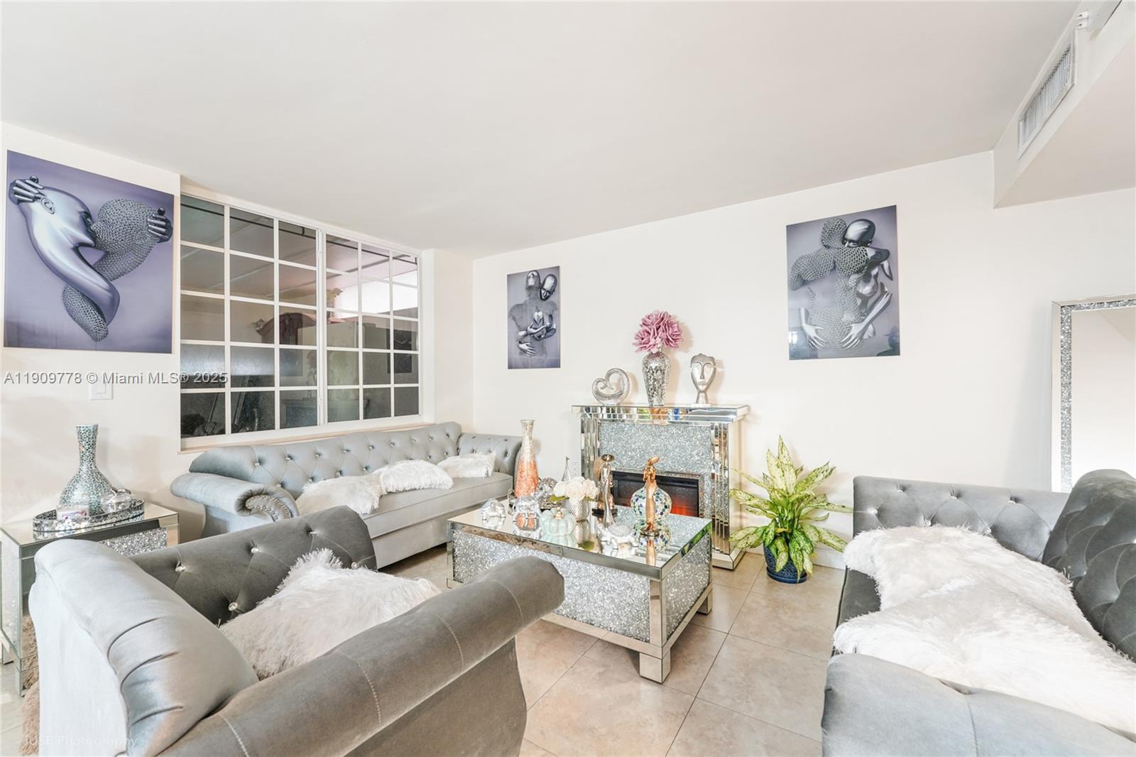 3900 West 11 Avenue, Unit 55 Hialeah, FL 33012 - Photo 3 of 12 a living room with furniture and windows