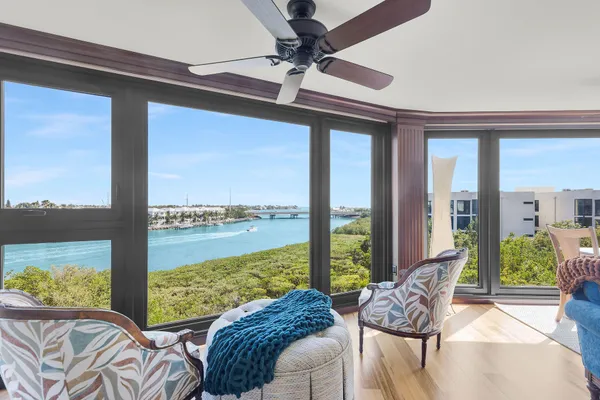 a view of a balcony with furniture and outdoor view