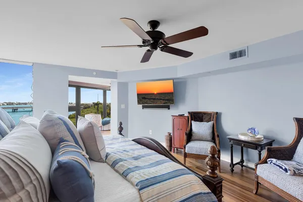 a bathroom with a toilet a sink and glass door