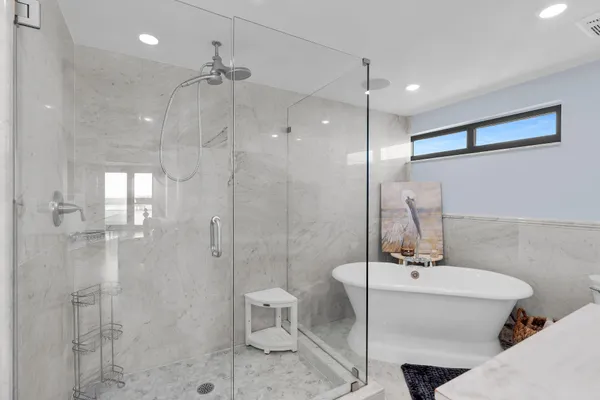 a living room with furniture and large window