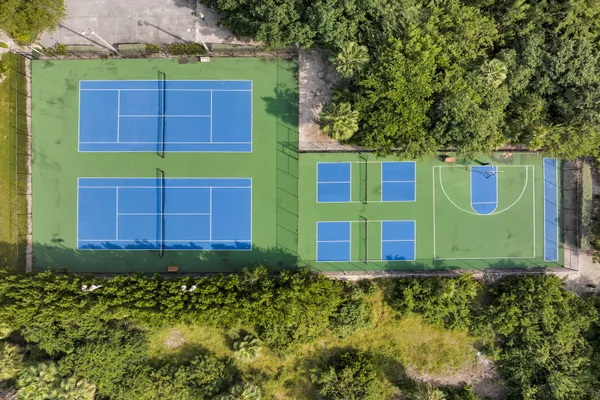 a view of a dining room with furniture wooden floor and chandelier