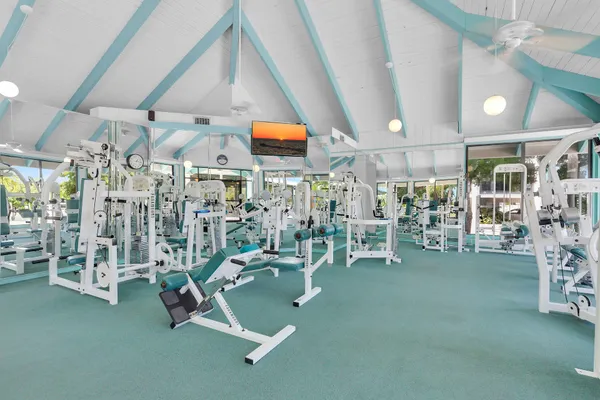 a living room with lots of furniture and a large window
