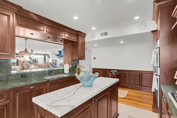 a kitchen with a sink and wooden cabinets
